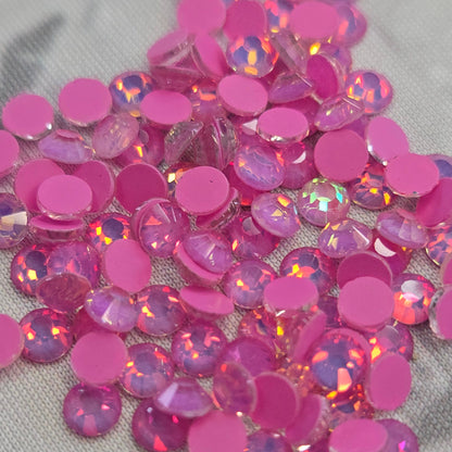 Mocca Dark Rose Opal Pink rhinestones on a gray fabric background