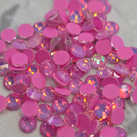 Mocca Dark Rose Opal Pink rhinestones on a gray fabric background