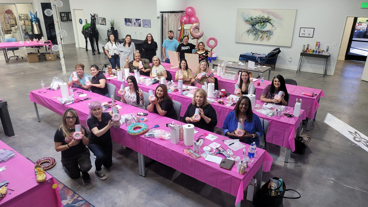 The Crystal Ninja in class with students holding rhinestone donut tumblers at the CrystalNinja studio