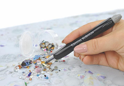 Crystal Kubaton pen-style wax pickup tool with chrome accents on white background.