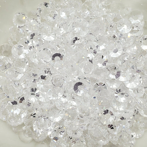 A plate of transparent clear glass rhinestones.